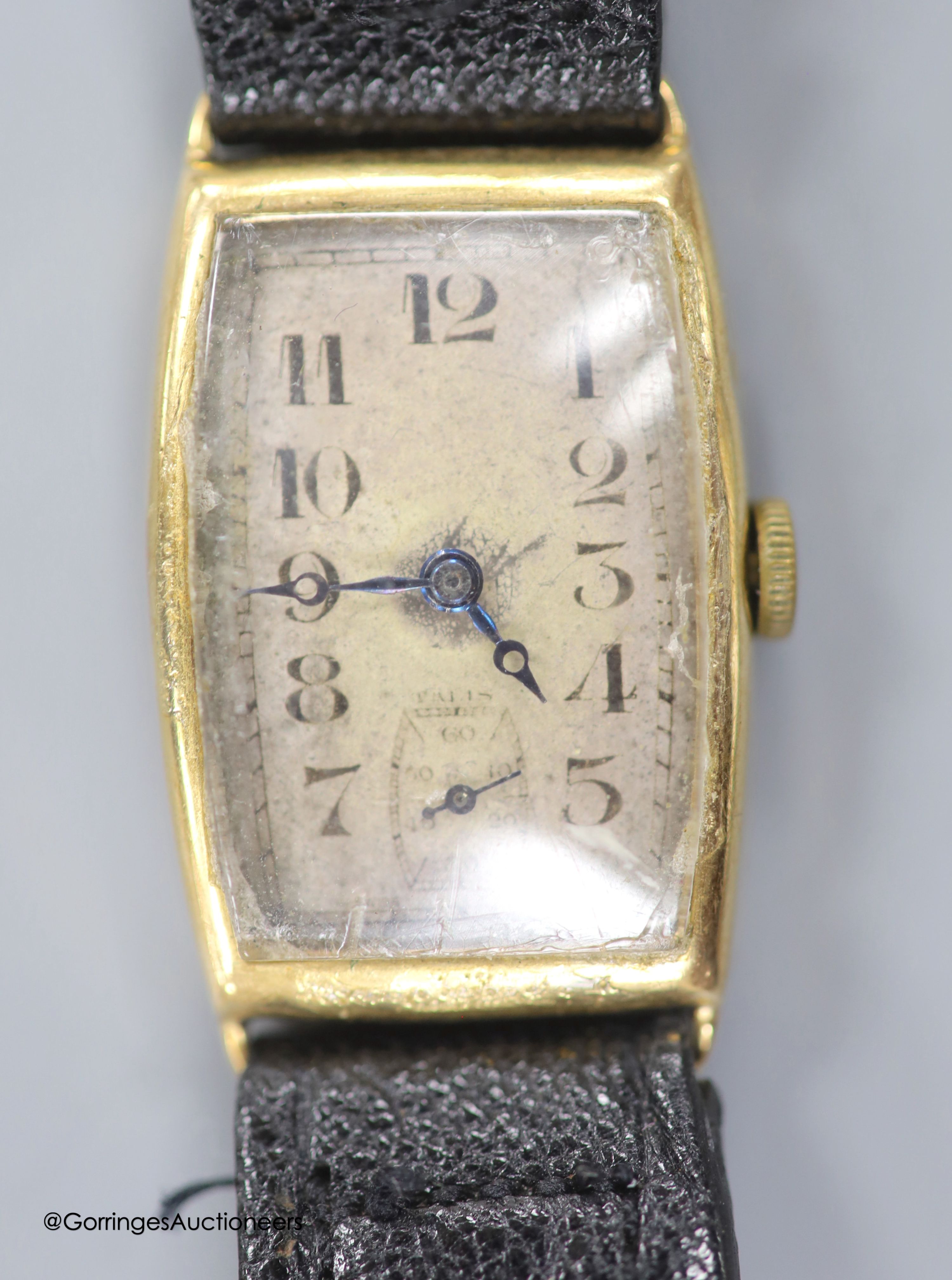 A gentleman's 1930's 9ct gold manual wind tonneau shaped wrist watch, with case back inscription, on leather strap